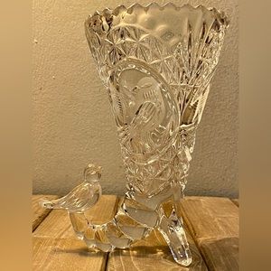 Glass vase with little bird.